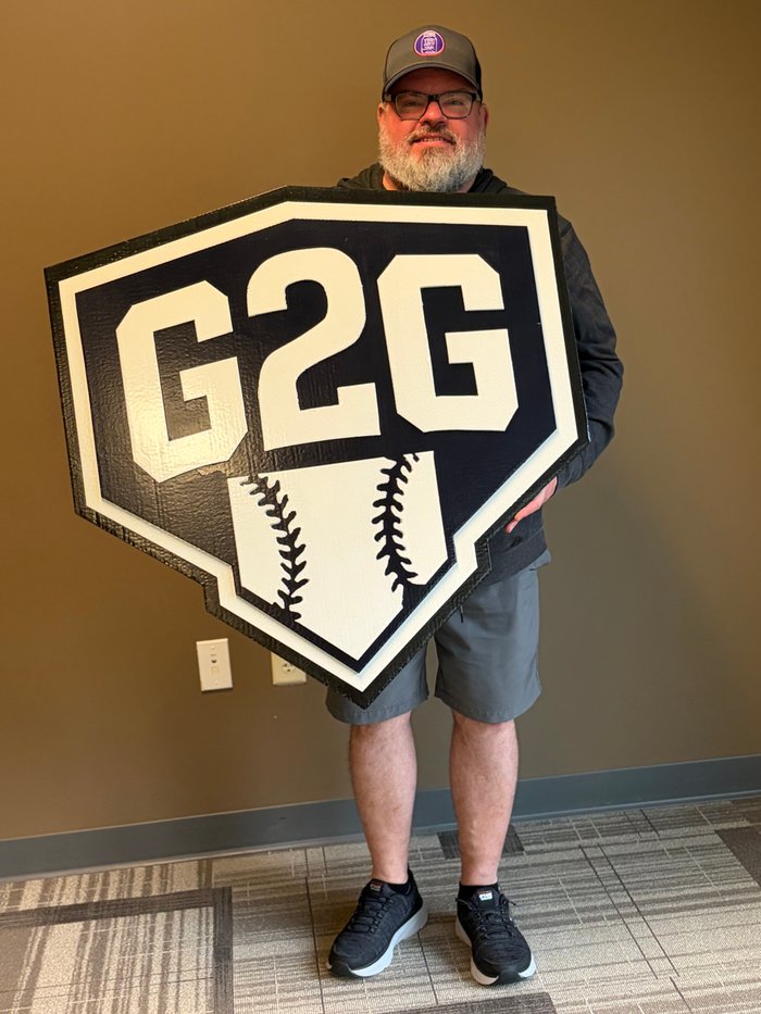 G2G custom business logo cutout, held by customer