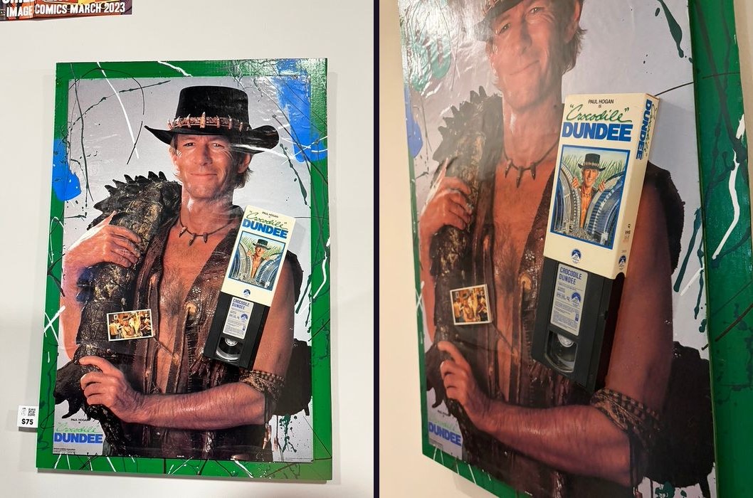Hand-embellished Crocodile Dundee poster with a VHS tape and photo, in a green splatter-painted frame, front and angled views