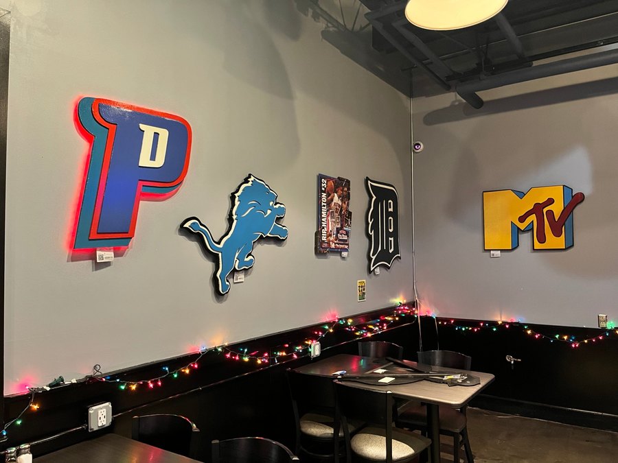 Custom Detroit Pistons LED-lit P logo on a bar wall with Lions, Tigers and MTV pieces