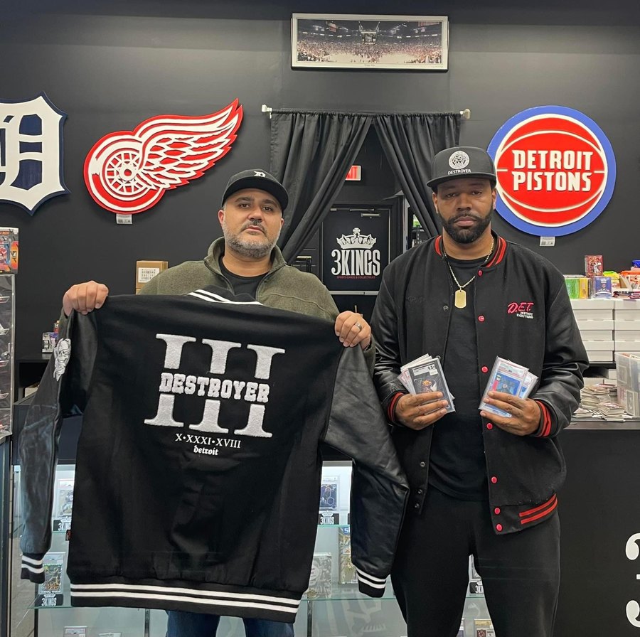 Custom Detroit Tigers, Red Wings and Pistons logo cutouts in a sports card shop