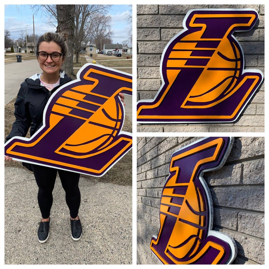 Custom Lakers logo cutout, held outdoors and close-up angles
