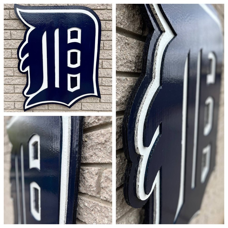 Custom navy and white Detroit Tigers Old English D cutout, three angles on brick wall