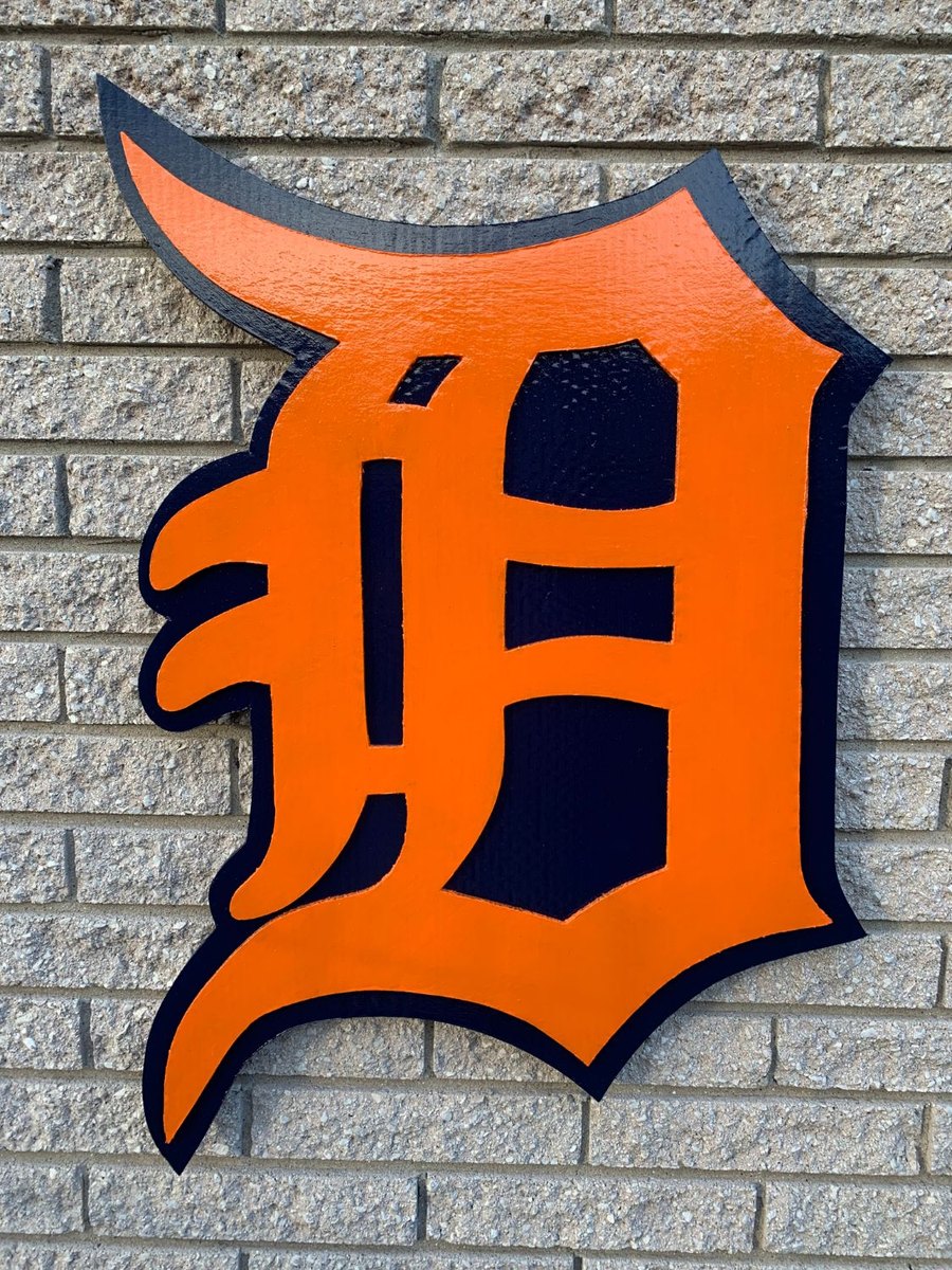 Custom orange and navy Detroit Tigers Old English D cutout on brick wall