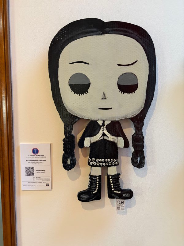 Hand-cut Wednesday Addams Funko-style cutout with its info card