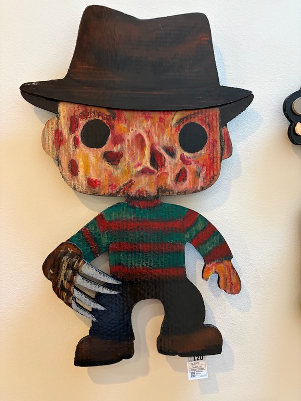 Hand-cut Freddy Krueger Funko-style cutout on the wall