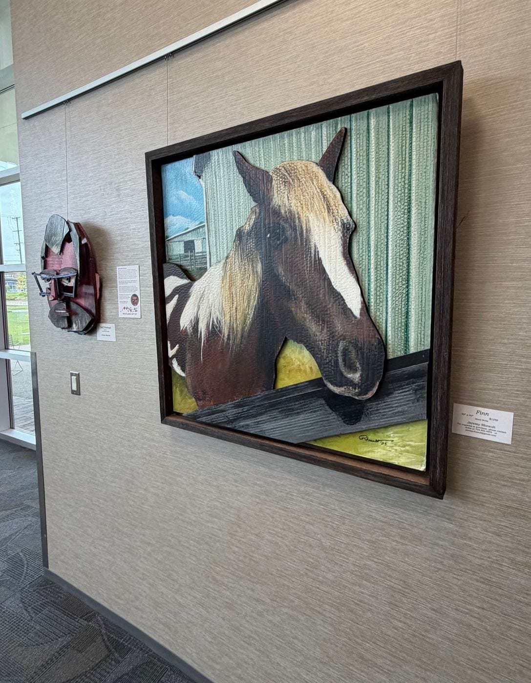 Finn, a framed mixed media horse portrait, on the gallery wall