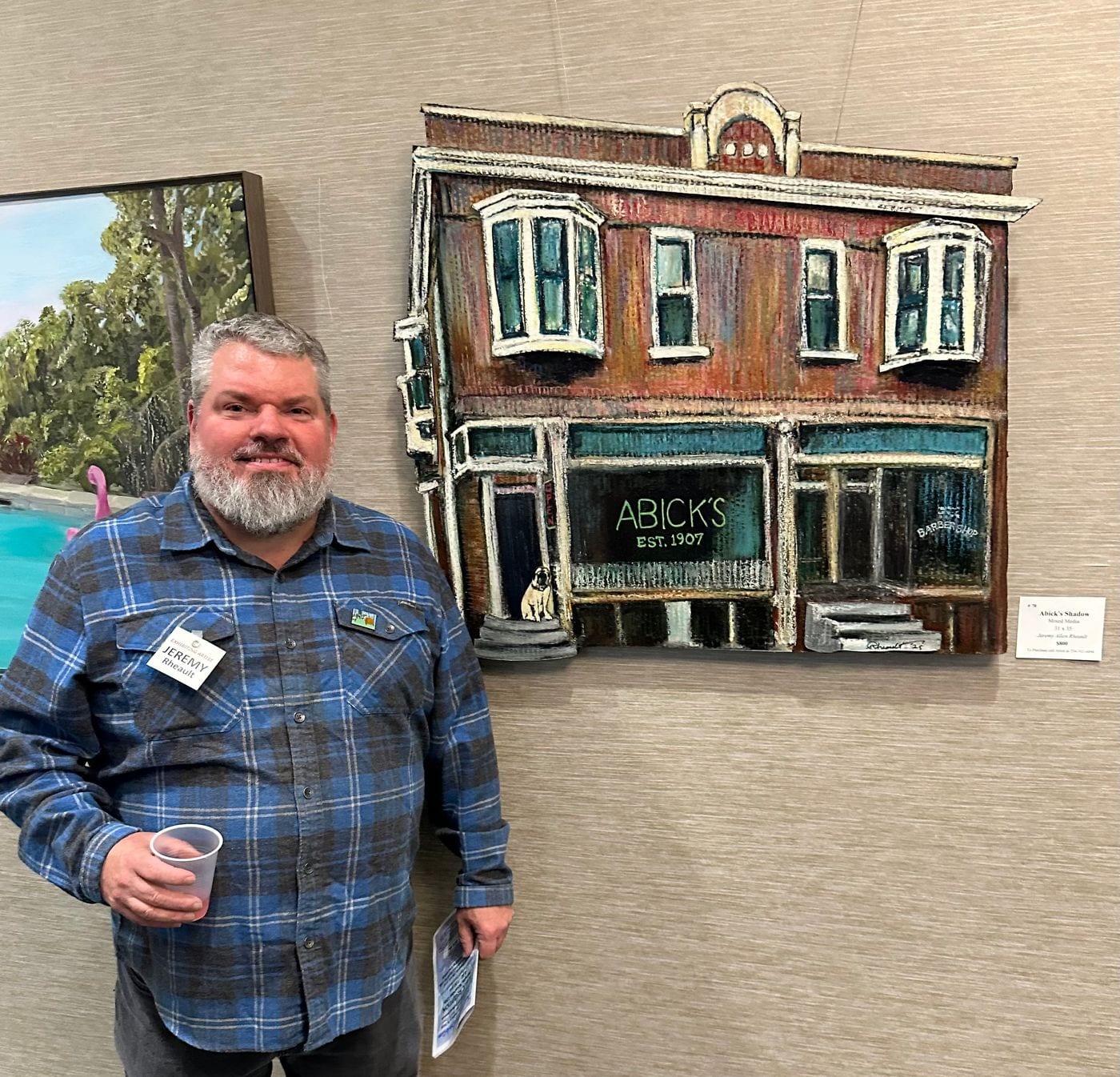 Jeremy Allen Rheault standing beside Abick’s Shadow at Westland City Hall