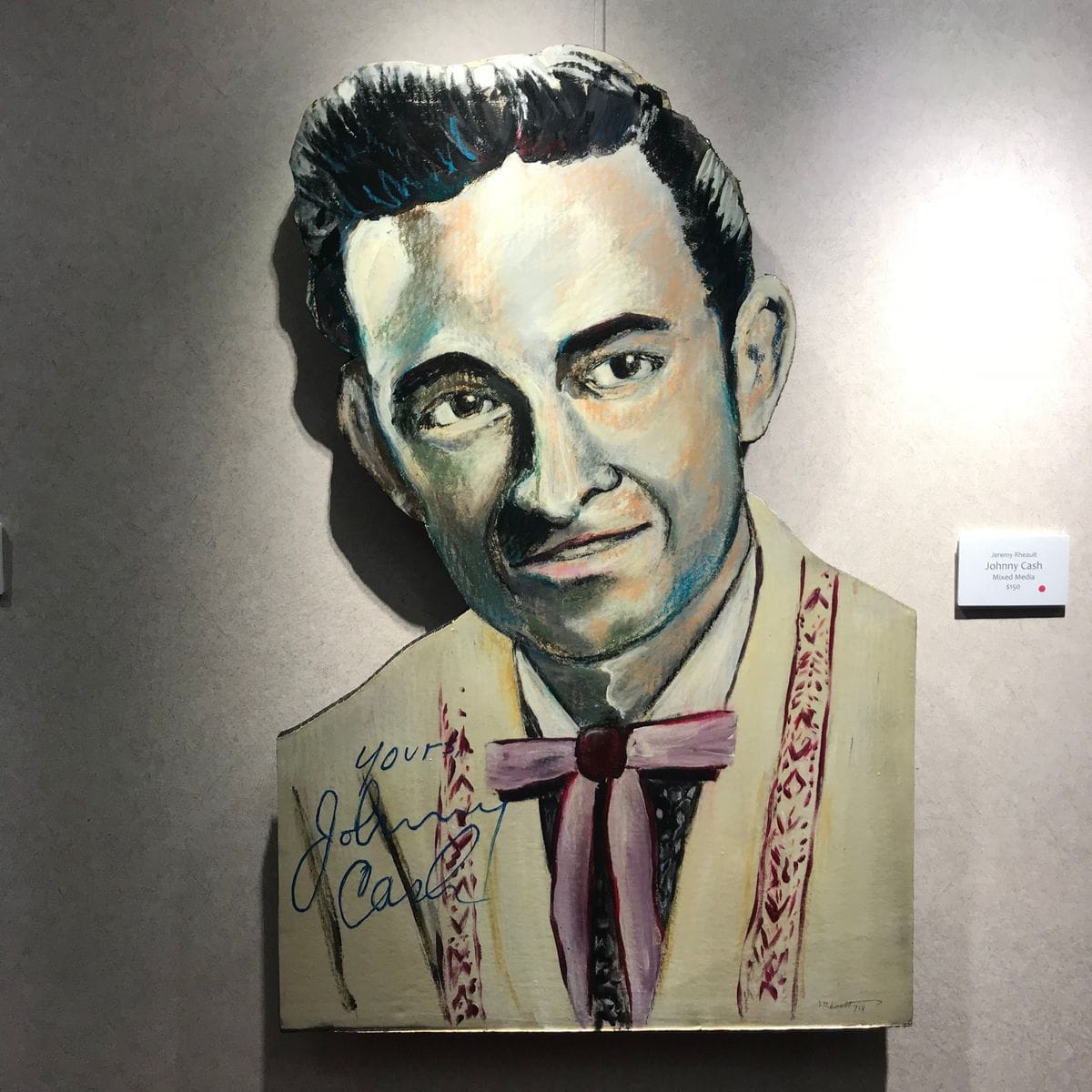 Johnny Cash by Jeremy Rheault on the wall at The Village Theater