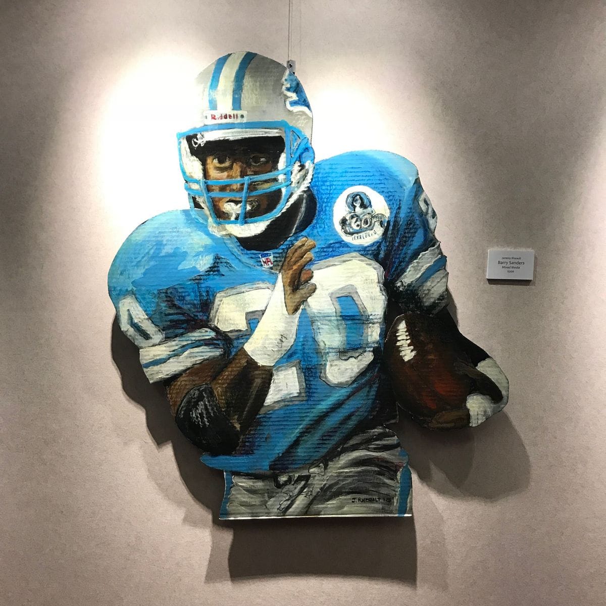 Barry Sanders by Jeremy Rheault on the wall at The Village Theater