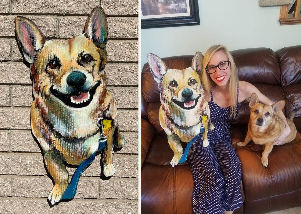 Hand-cut and hand-painted portrait of Boo Boo, a smiling corgi mix with a blue leash, on a brick wall, and on a couch beside the owner and the real Boo Boo