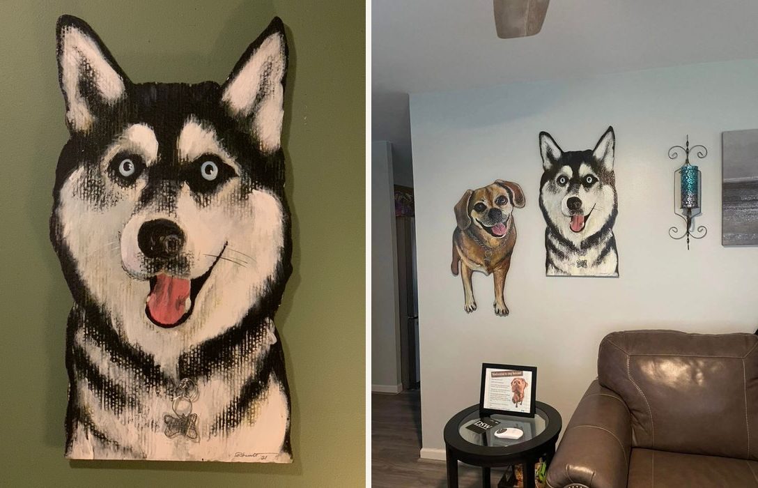 Hand-cut and hand-painted portrait of Dexter, a black and white husky with blue eyes, on a green wall, and both dog portraits, Dexter and Abby, hanging on a living room wall
