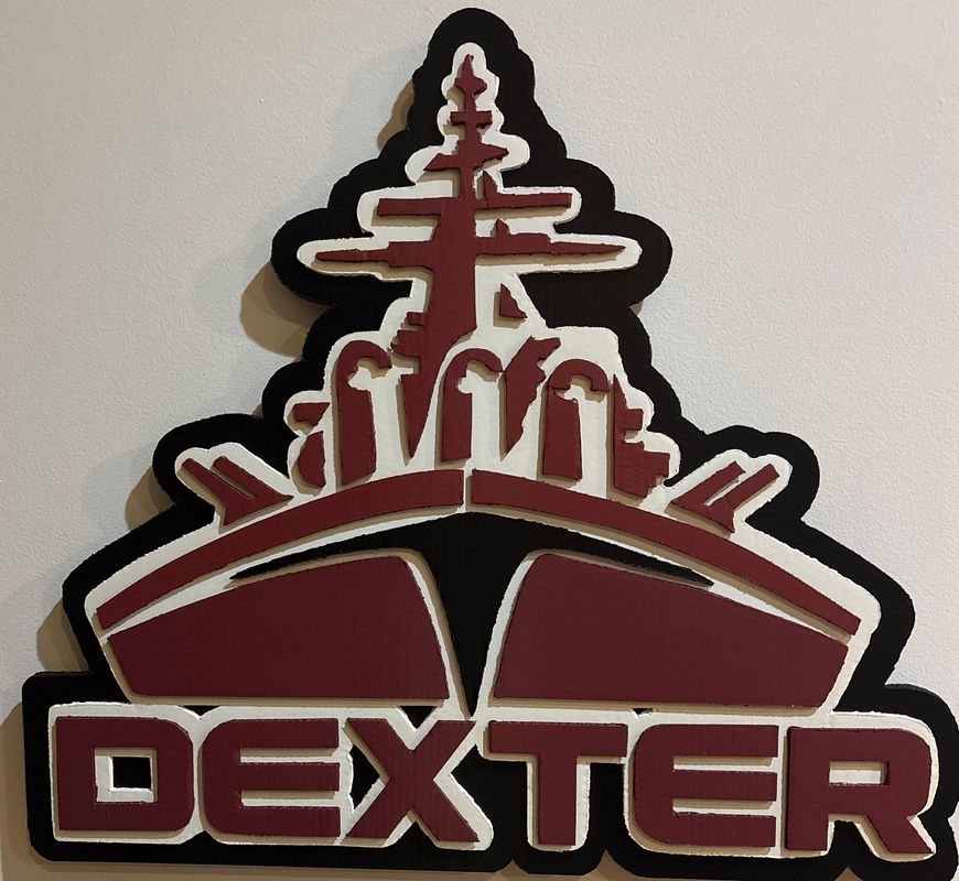 Dexter High School fan art logo cutout with a battleship and DEXTER lettering in maroon, white and black