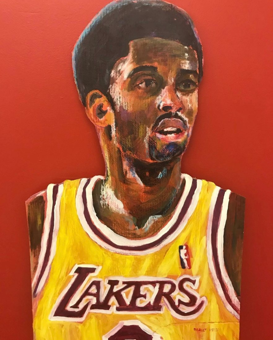 Hand-cut and hand-painted portrait of Kobe Bryant in a gold Lakers jersey, on a red wall