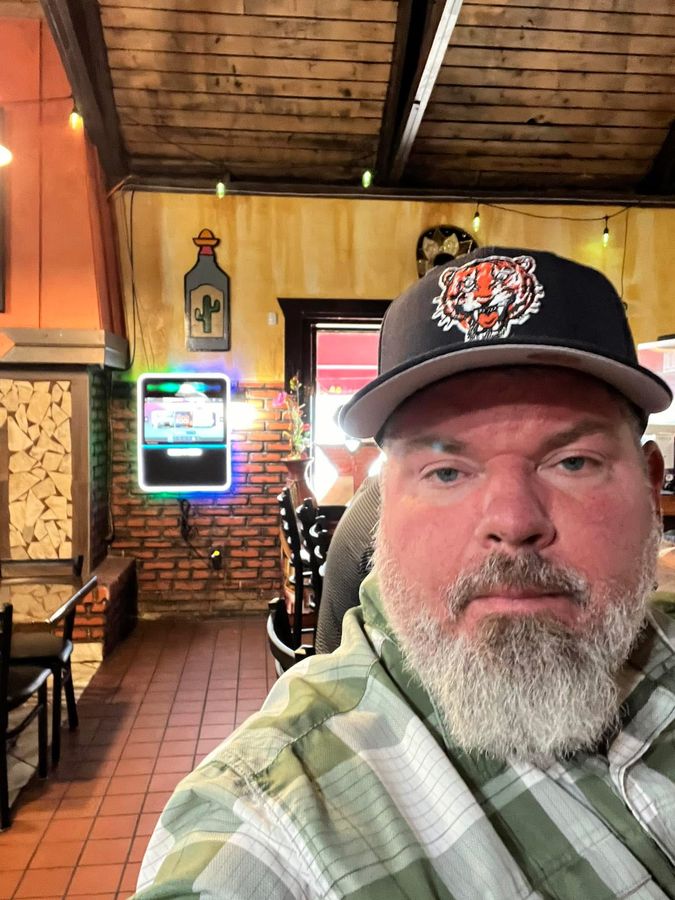 Jeremy Rheault taking a selfie in a Tigers cap at Los Amigos