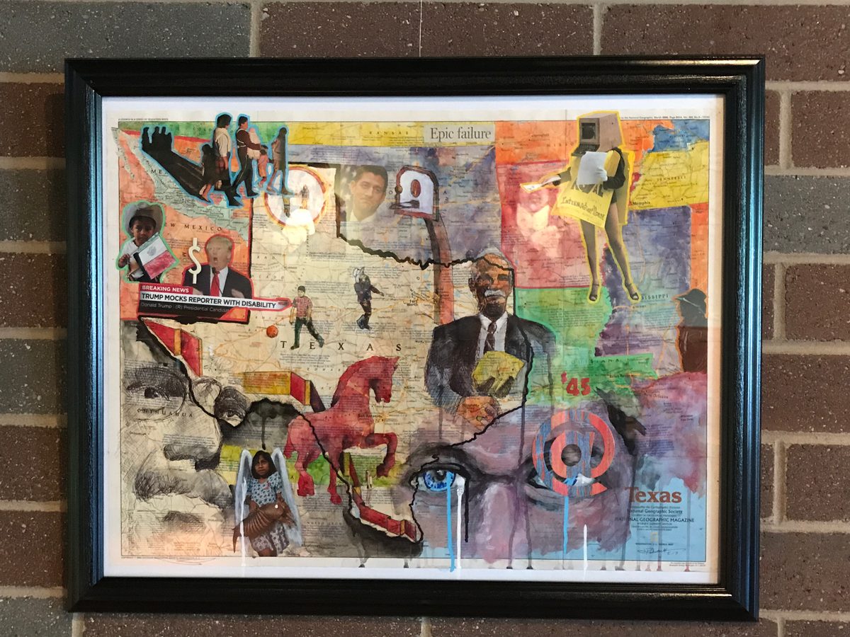 Framed mixed media collage with a map of Texas, newspaper clippings, painted horses and portraits, hung on a brick wall