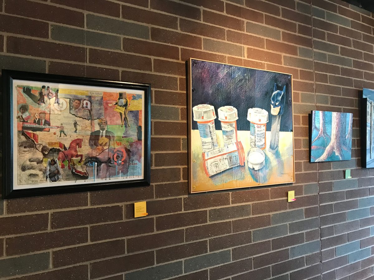 The exhibition wall in June 2017 with the framed Texas collage, Pills and Pez and the tree roots painting