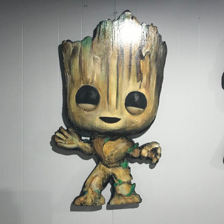 The hand-cut Groot Funko-style cutout on a white wall at Popgodz